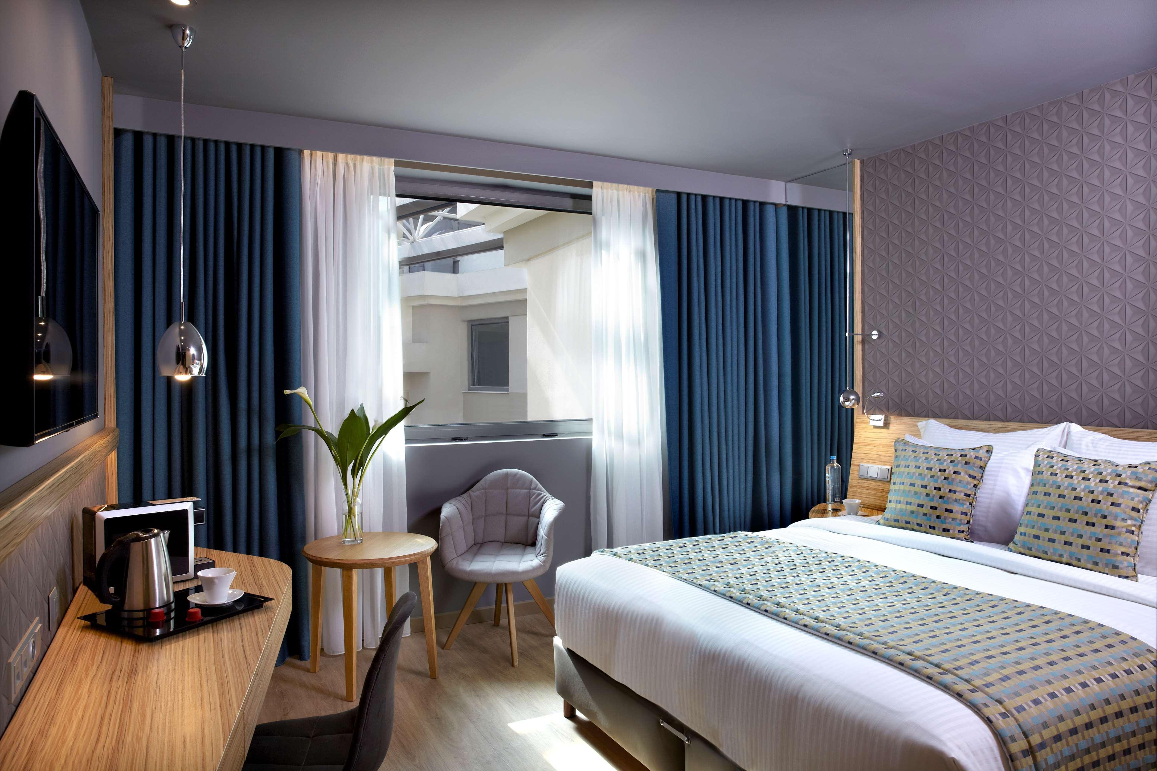 Hotel Wyndham Grand Atene Esterno foto A room at the hotel