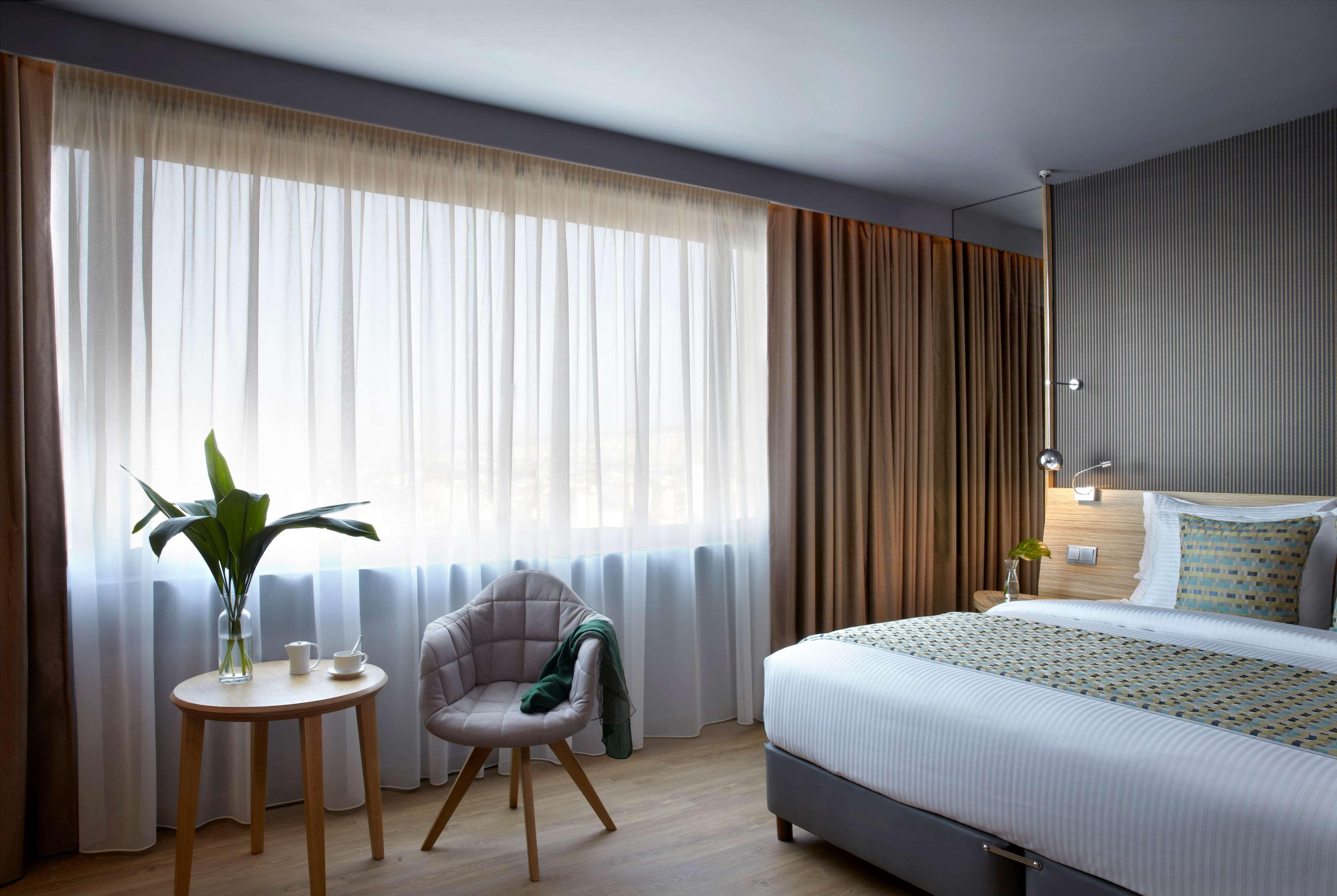 Hotel Wyndham Grand Atene Esterno foto A room at the hotel