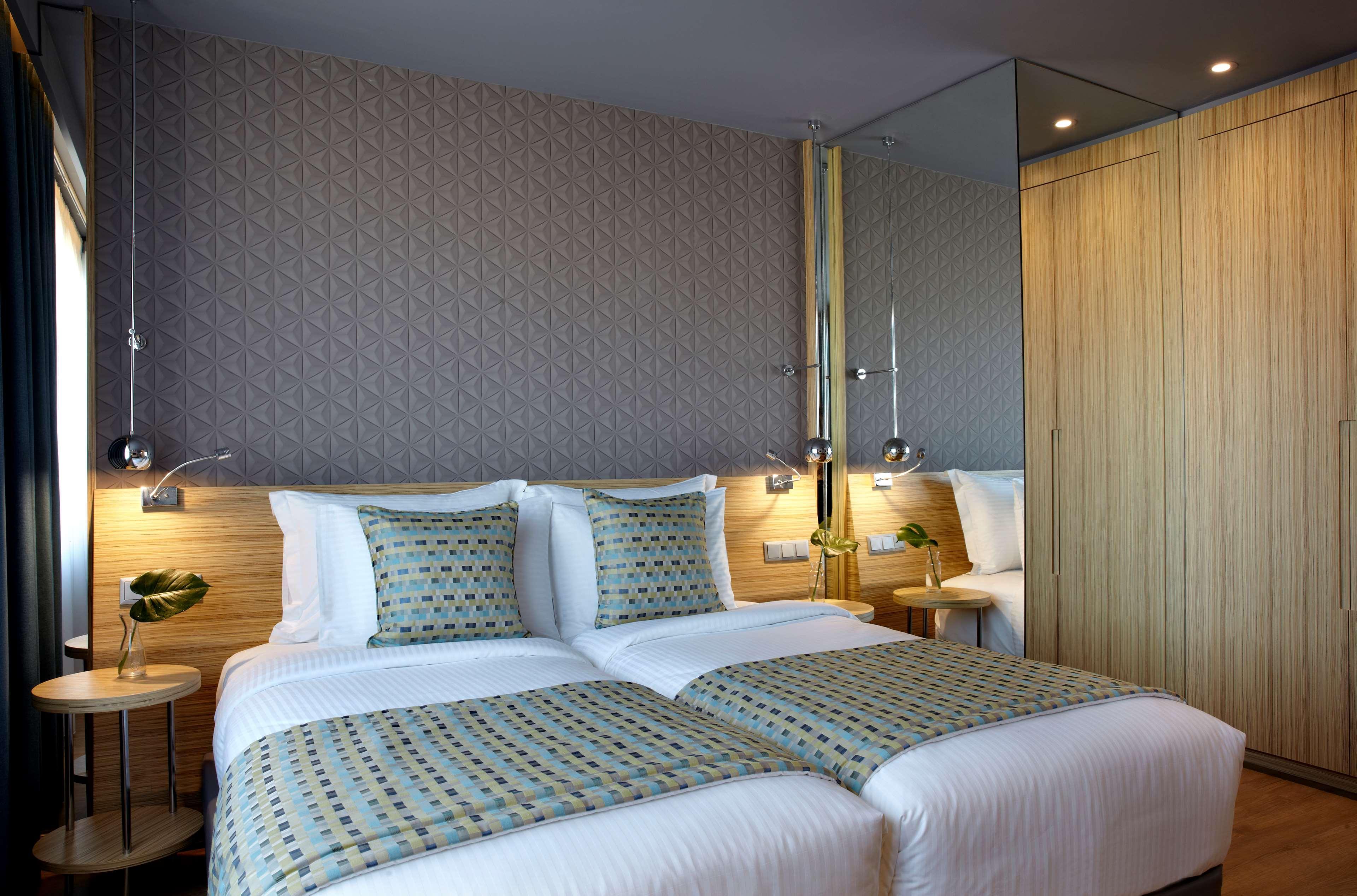 Hotel Wyndham Grand Atene Esterno foto A room at the hotel