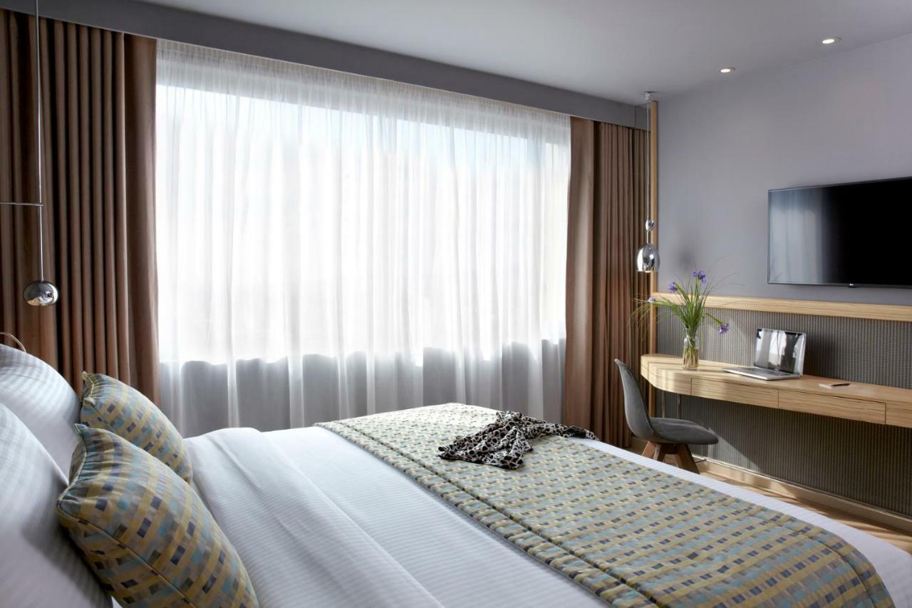 Hotel Wyndham Grand Atene Esterno foto A bedroom at the hotel