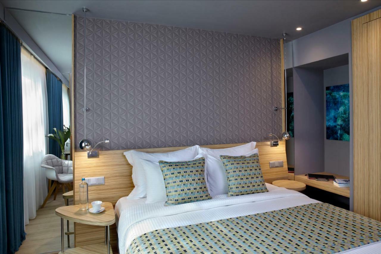 Hotel Wyndham Grand Atene Esterno foto A room at the hotel