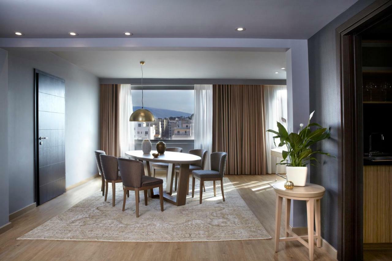 Hotel Wyndham Grand Atene Esterno foto A dining room